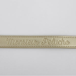 photo produit colliers en cuir or avec le logo estampé Monsieur Peluche 